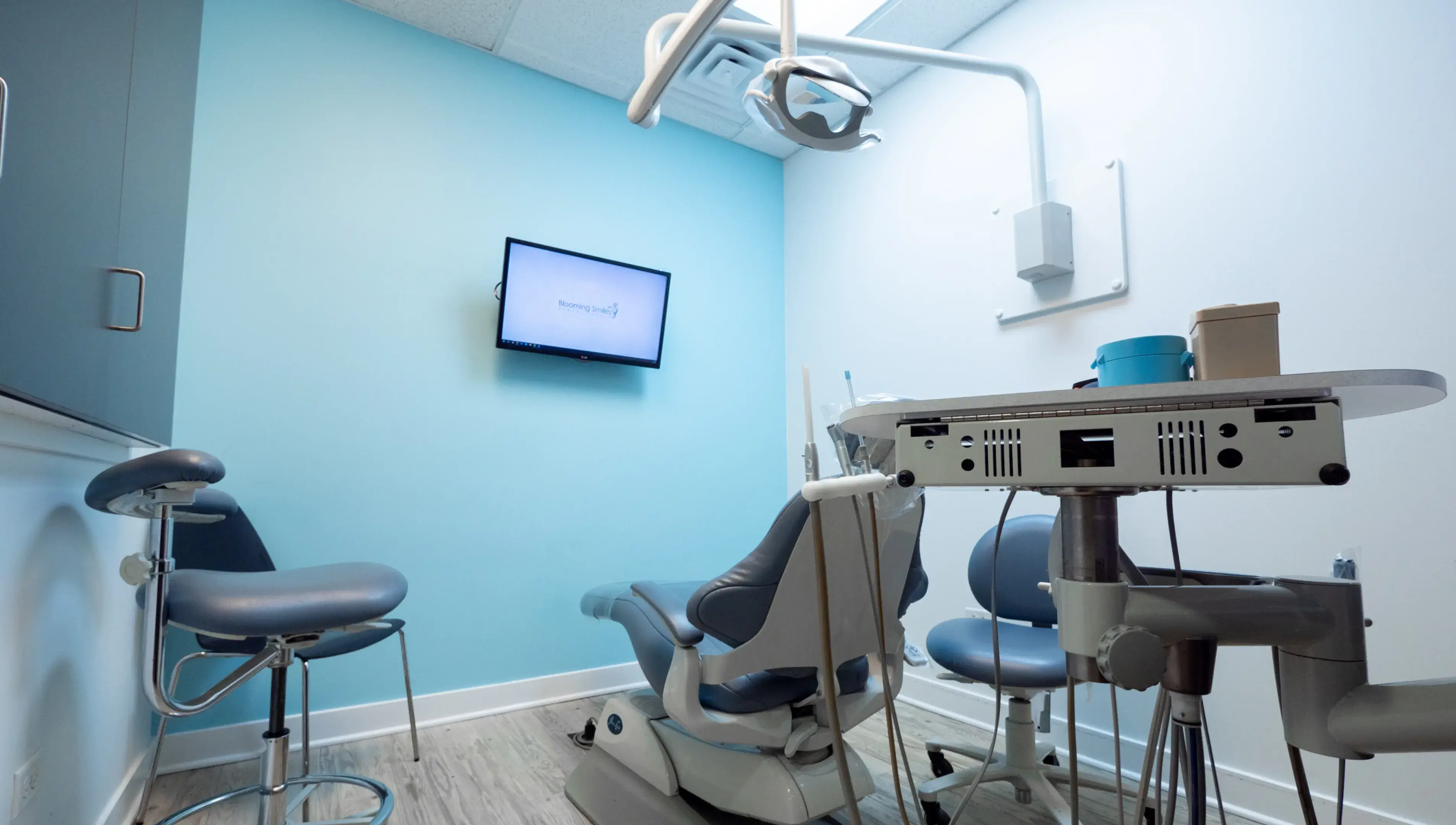 a room with a tv and dental equipment